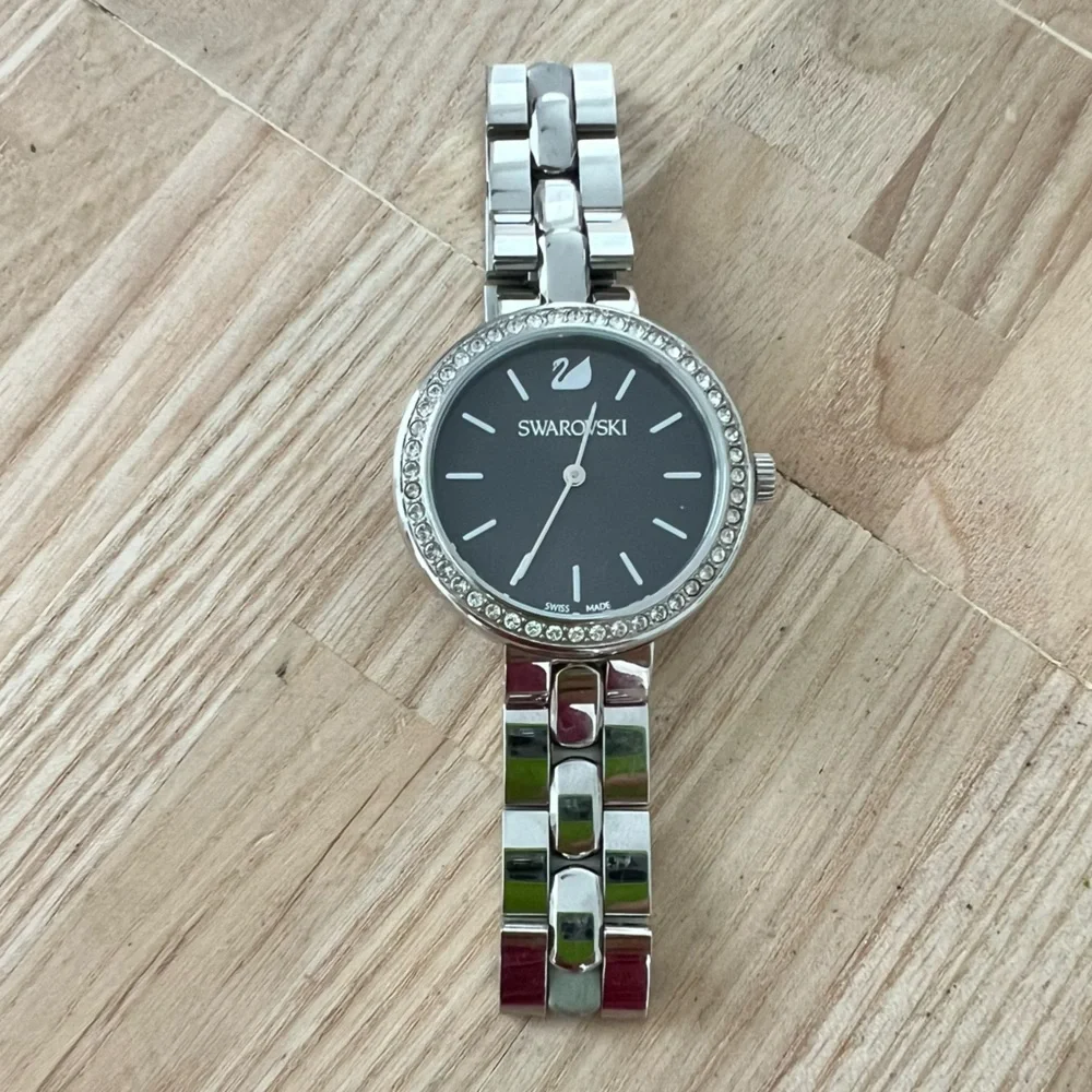 Swarovski ladies stainless steel charcoal gray dial dress watch NEW BATTERY